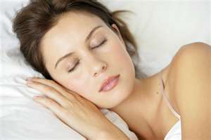 sleeping middle age woman resting on a pillow